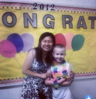 Me and my kindergarten teacher Mrs.Chun(Chunn). I think this is when I graduated to 1st grade.