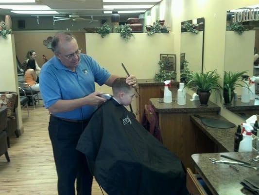 Barber in the front, ladies pedicures etc in the back.