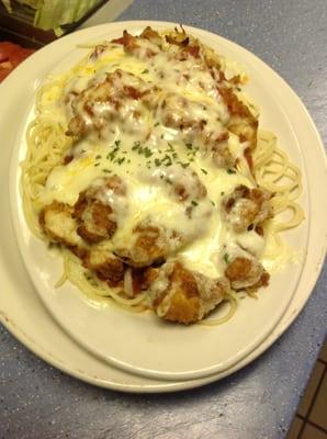 chicken parmigiana over pasta