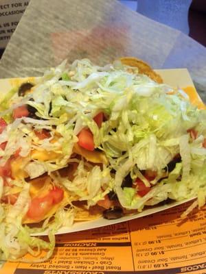 Super nachos - sub lettuce for meat. Comes with sour cream & taco sauce.