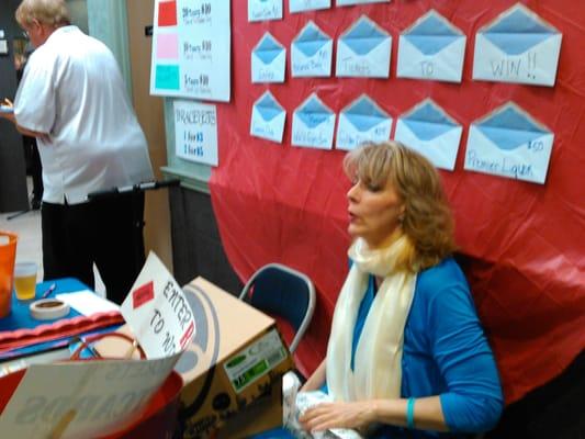 Jennifer's Aunt (also my cousin),  running the Basket raffle tickets and Gift certificate wall (suggested by K of C)