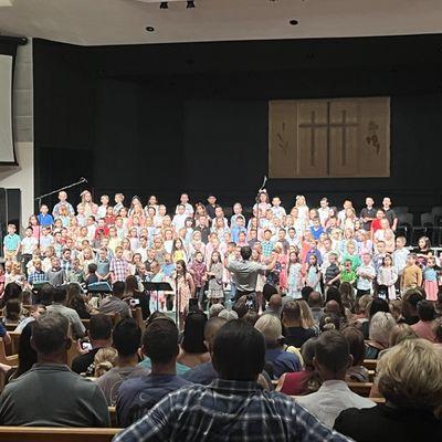 Children singing.