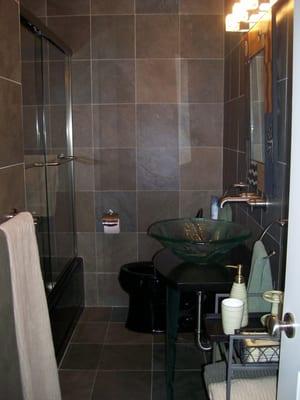 bathroom remodel using slate tiles to give it a natural appearance.