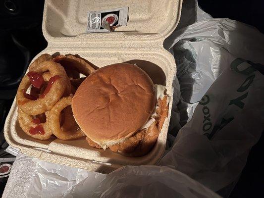 Chicken sandwich and onion rings meal