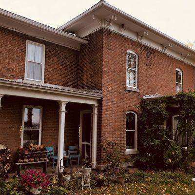 Side of the home with a wisteria vine as old as the house 1850s