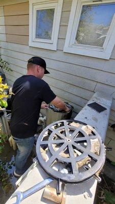 Josh, the owner, cleaning a filter