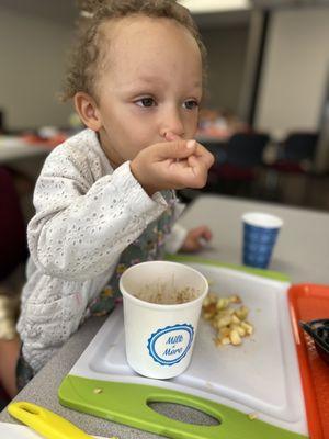 My daughter making overnight oats with apples at Native health Read and It.