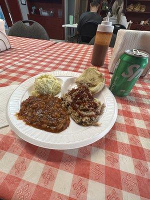 Pulled pork sandwich, cowboy beans, and potato salad.