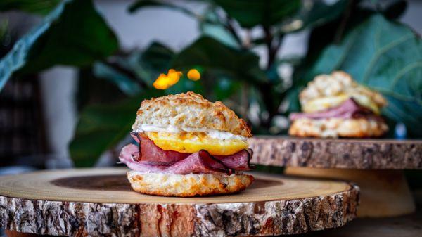 Breakfast Sandwich with eggs, ham, garlic aioli on a biscuit. YUM!