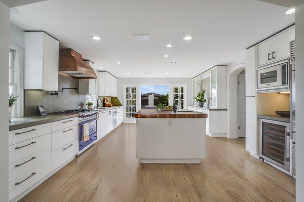 We transformed this stunning kitchen from a yucky green color to this!