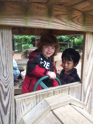 Playing outside on the wooden train