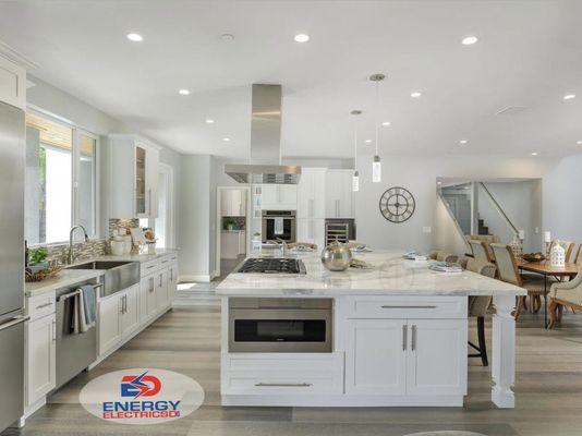 Large open kitchen with LED recessed can lights and pendants