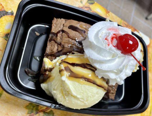 Huge Brownie Sundae with chocolate sauce, Carmel sauce, whipped cream and cherry!