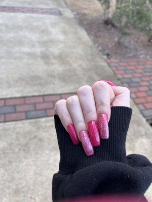 my long glittery hot pink nails by Lily