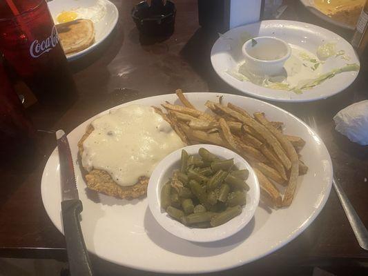 chicken fried steak with white gravy, fries, and green beans 11.95$