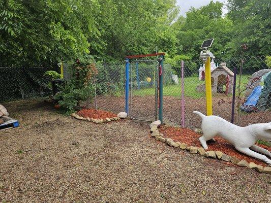 Wonderful play yards filled with toys and buildings for dogs to enjoy.