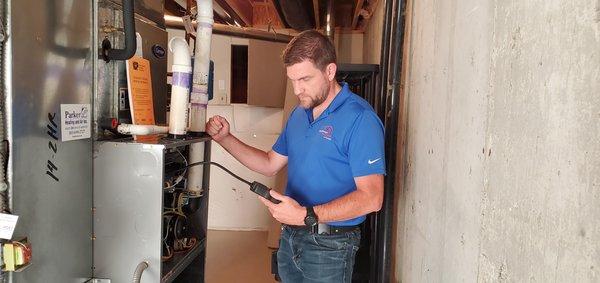 Kevin inspecting a furnace