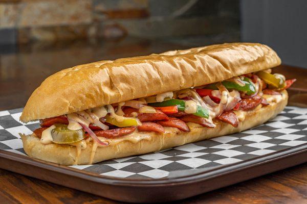 Hot Dog Shooter:
Sliced Hot Dog grilled with onions, peppers and signature dressing.