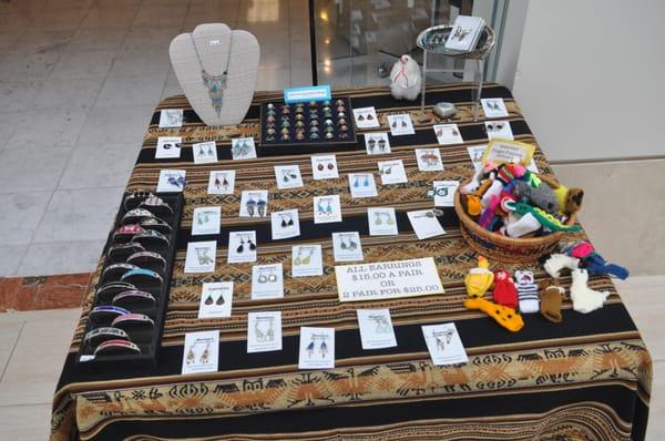 Entrance table with earrings, bracelets, rings, finger puppets