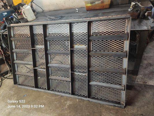 Heavy duty trailer gate for landscaping equipment.