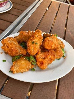 Salt and pepper fried chicken wings . Delicious