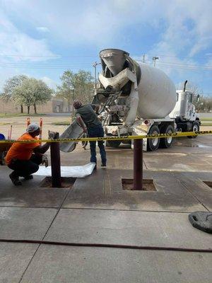 Installing pipe bollards at Security Sporting Goods, Alexandria, LA