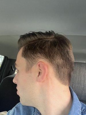 Too high over ears... barber was unable to cut a clean line.