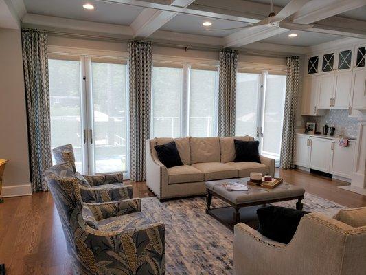 Living room panels with solar shades on the french doors