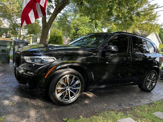 X5 after an interior and exterior detail in customers driveway.