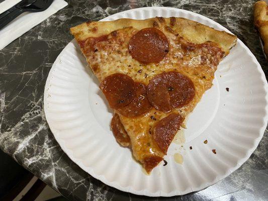 Pepperoni slice from a 14 inch pie.