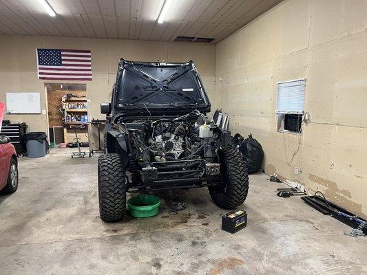 Jeep engine replacement. The old engine was knocking and upon diagnosis we found the crankshaft bearings are bad.