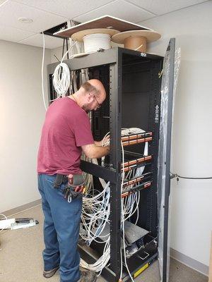 DFT employee Quentin is hard at work installing the MDF for our neighbors at Family Church Fredonia.