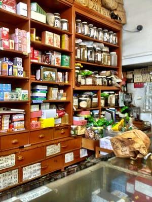 Many herbs and tradition Chinese medicines behind the counter.