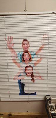 family photo on window shades