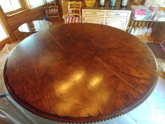 A once slime party damaged dining room table. 8 feet in diameter. I used a brush.