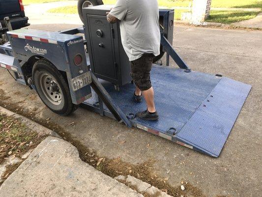 Hydraulic trailer used to safely and easily move your safe, they even have equipment to get heavy safes upstairs.