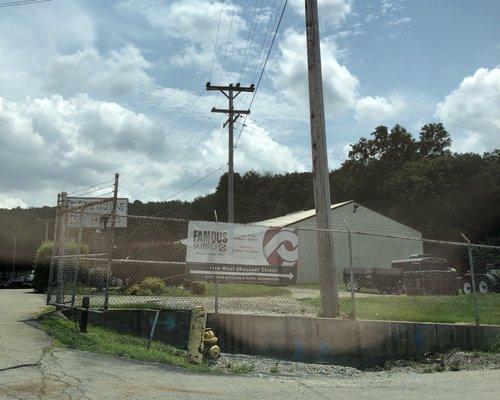 From W. Chestnut St., turn onto Baird Ave to see this sign and follow road as it goes to the right.  Store is behind Rail Road tracks