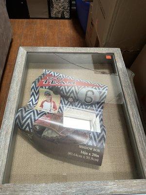 Hobby Lobby Wood Shadow Box's  glass that was cracked in two places caused by the mover's failure to follow prior moving instructions