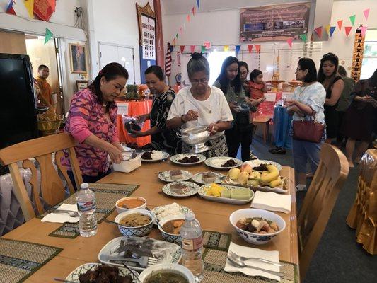 People come and offering food for monks