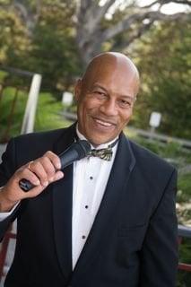 Dj Kevin posing for photo at a wedding at the Monterey Hyatt