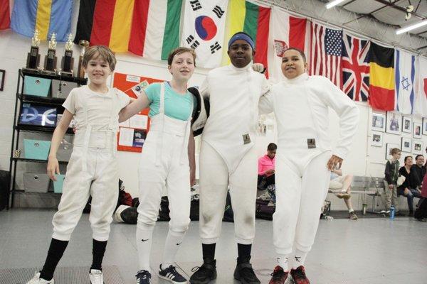 Young fencers enjoy a break during a youth tournament at DC Fencers Club.