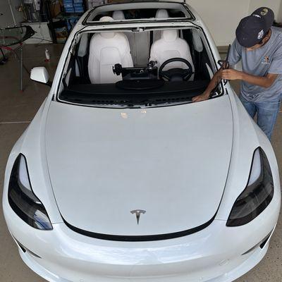 Auto glass shop Tesla windshield replacement and glass roof.