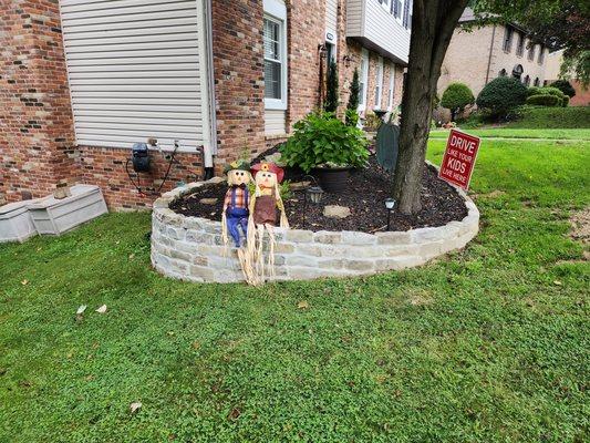 Retaining wall built. All new landscaping installed