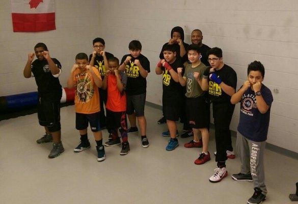 Youth class with coach Cerresso Fort in the back right.