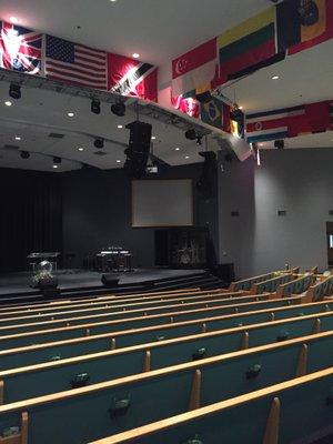 Inside sanctuary with flags from around the world