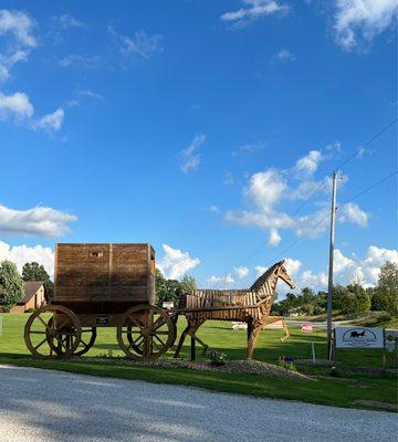 Wooden horse by the entrance to the parking lot