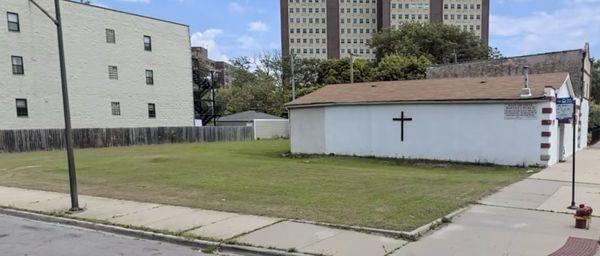 Google maps photo of the field and church wall on the outside.