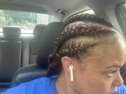 Uneven braids, too much hair, parts crooked a mess color add in not good