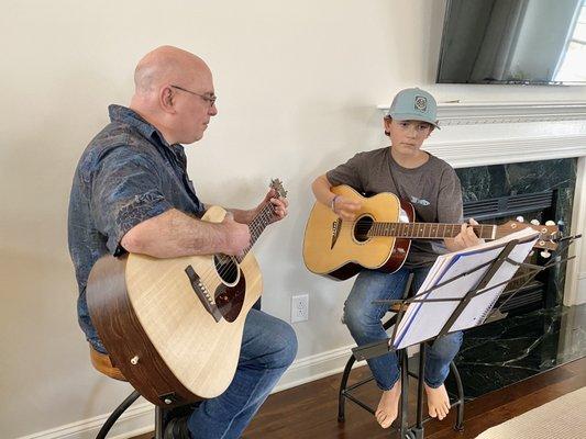 John and a student at an in-home lesson