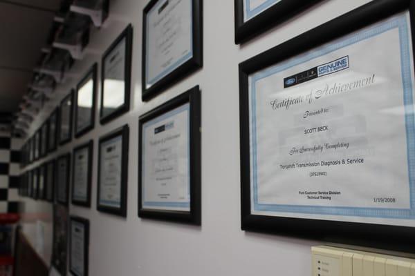 A few of Scott Sr.'s certification awards